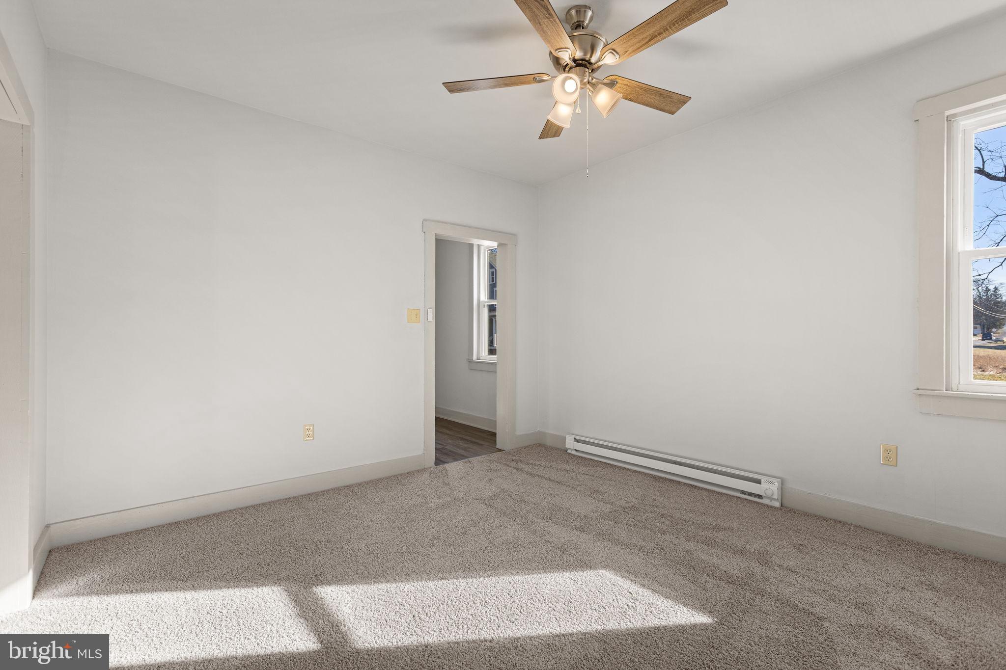 1586 Schwaben Creek Road Dornsife, PA 17823 - Photo 18 of 39 an empty room with windows and fan