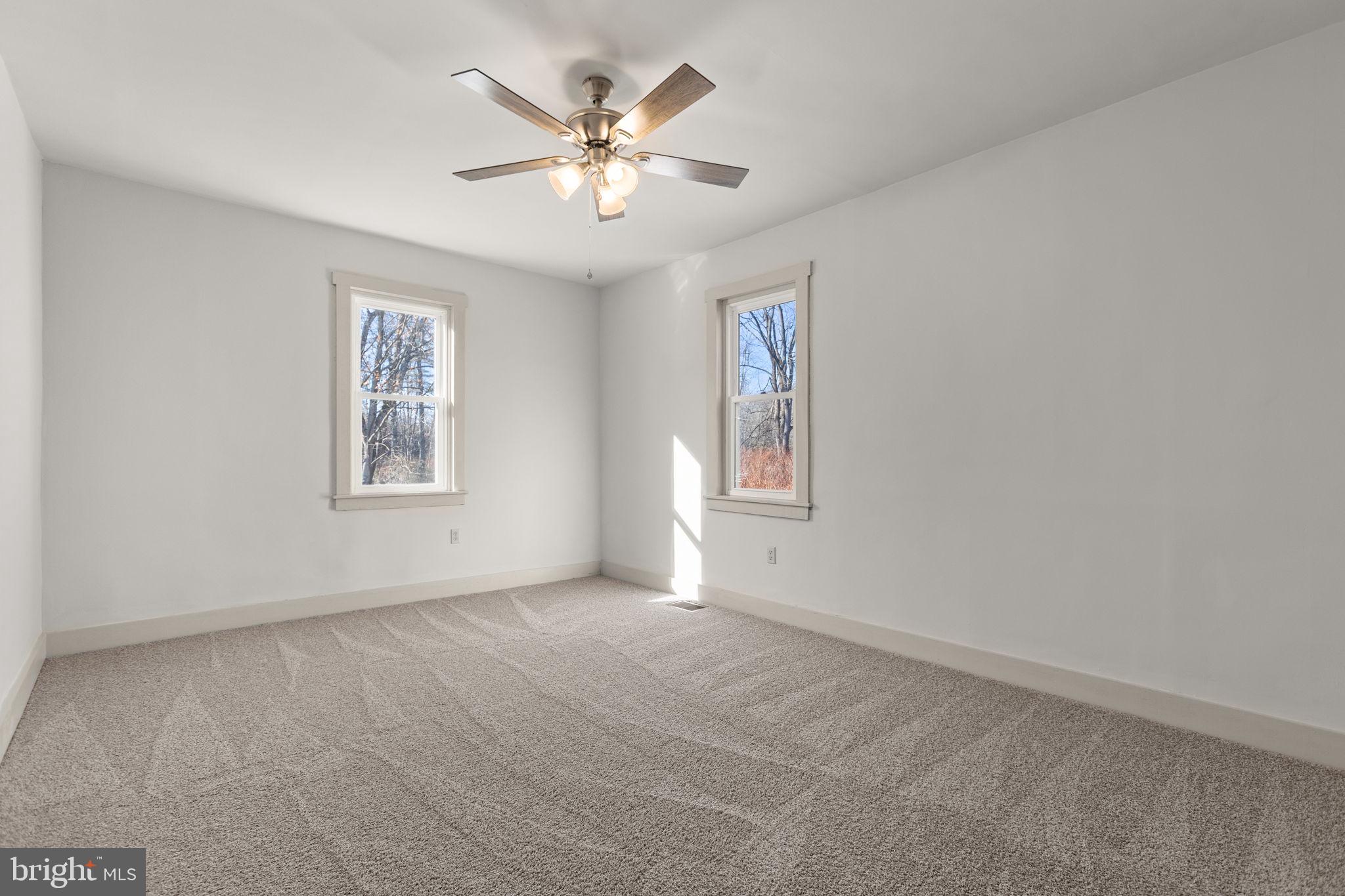 1586 Schwaben Creek Road Dornsife, PA 17823 - Photo 22 of 39 an empty room with windows and fan
