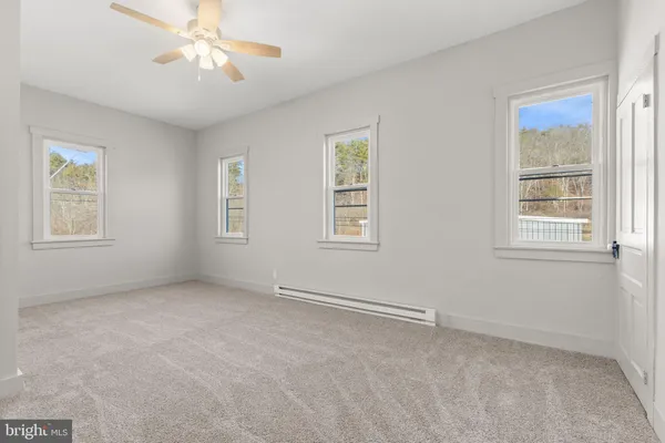 a view of an empty room with a window