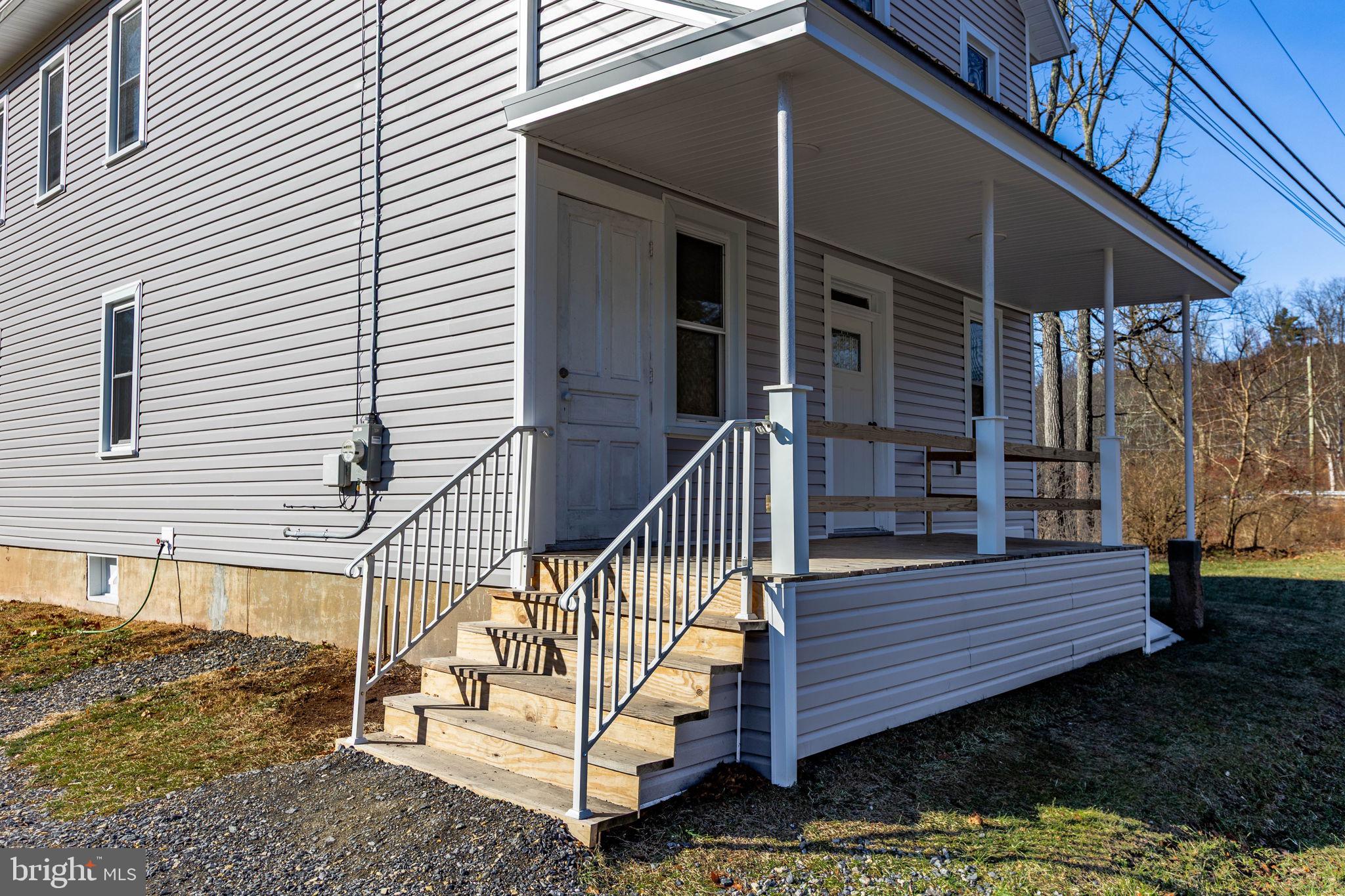 1586 Schwaben Creek Road Dornsife, PA 17823 - Photo 34 of 39 a view of wooden house with a small yard