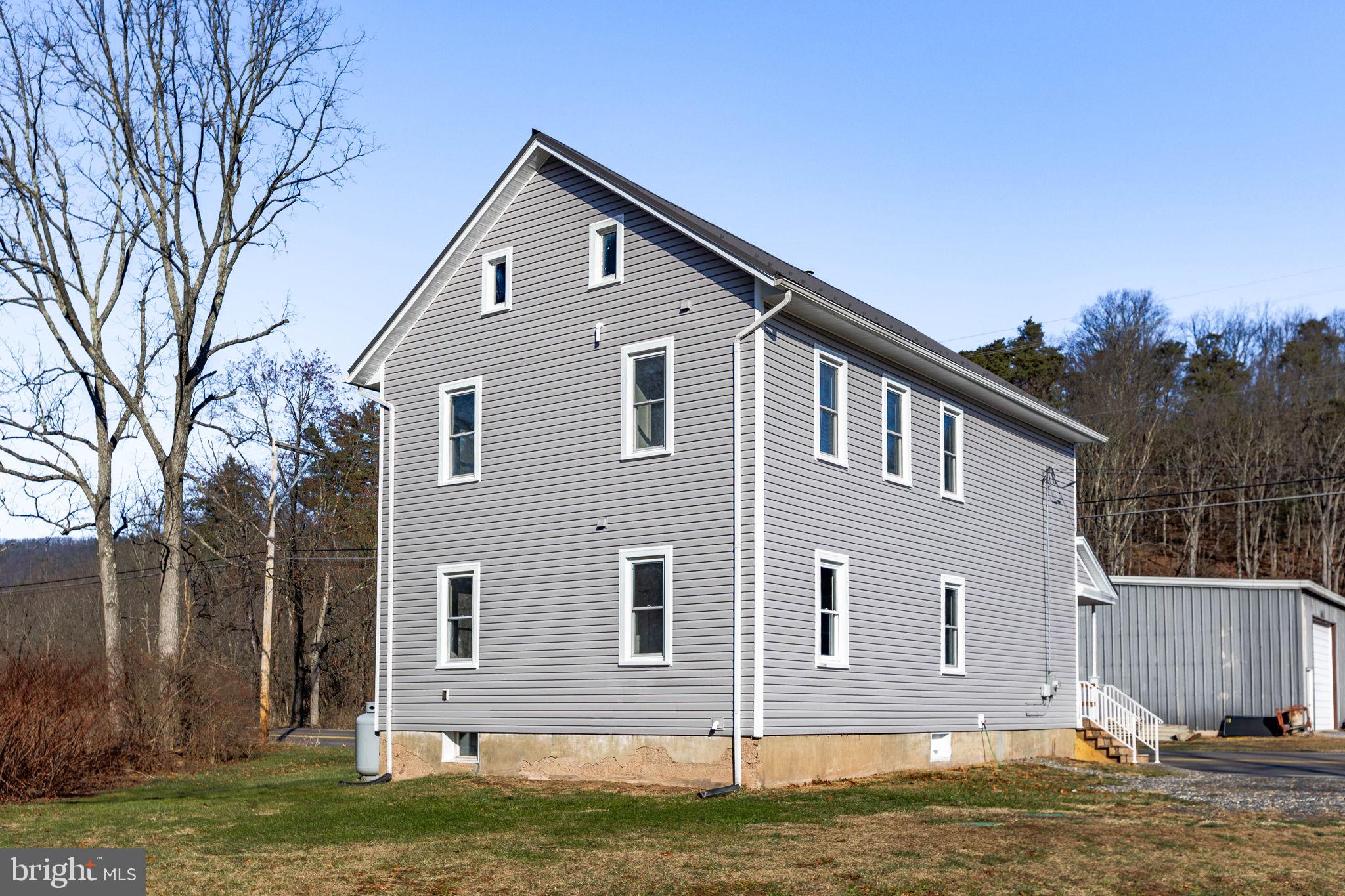 1586 Schwaben Creek Road Dornsife, PA 17823 - Photo 35 of 39 a front view of a house with a yard