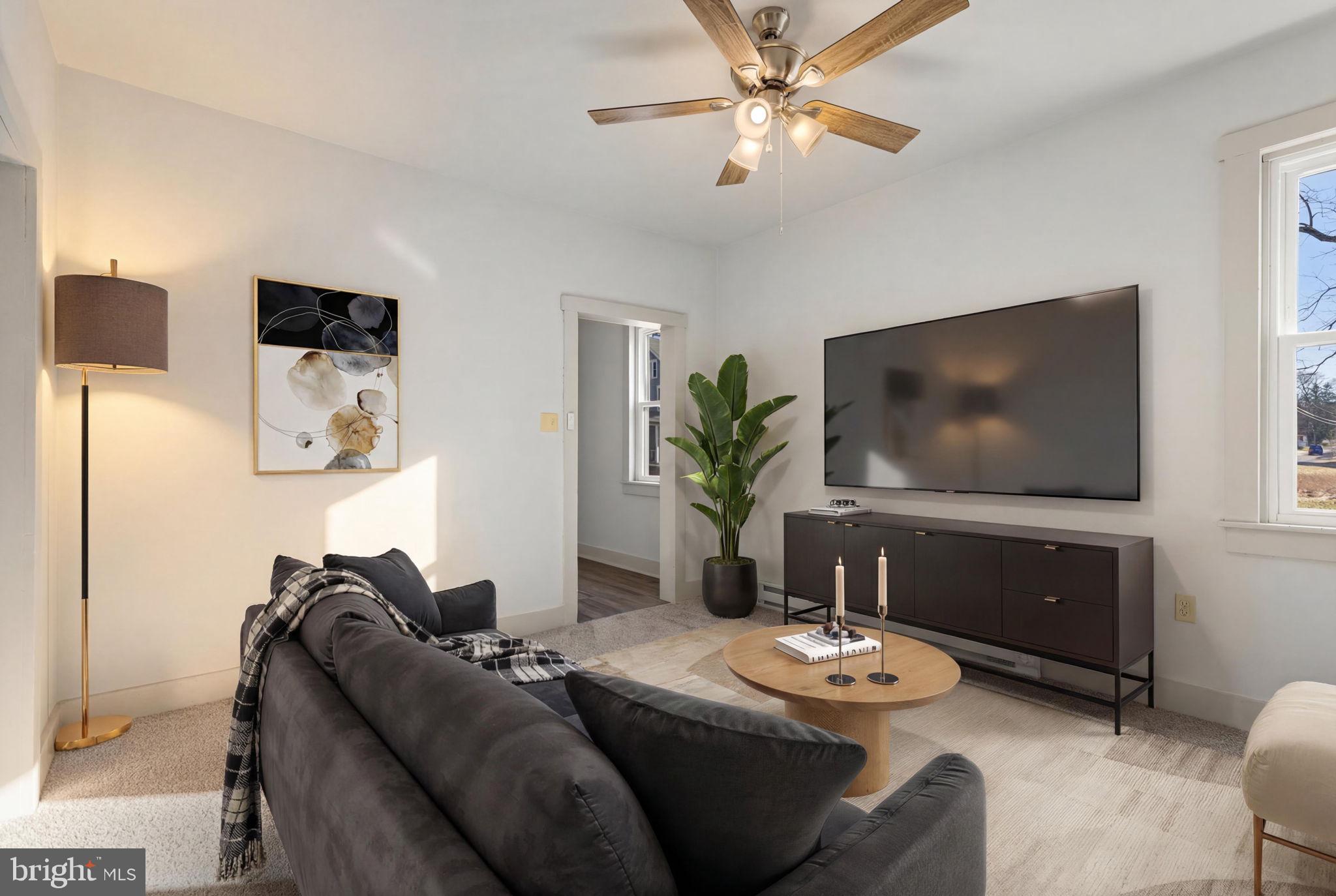 1586 Schwaben Creek Road Dornsife, PA 17823 - Photo 6 of 39 a living room with furniture and a flat screen tv