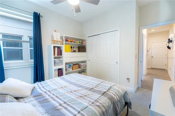 a bedroom with a bed and a dresser