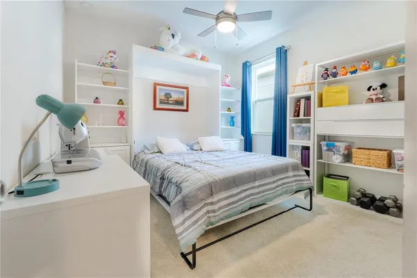 a bathroom with a double vanity sink toilet and a mirror