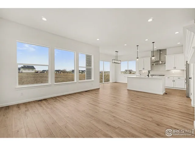 a view of kitchen with wooden floor