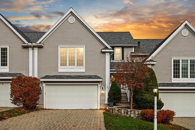 a view of a house with a yard and garage