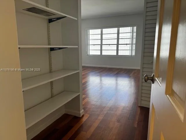 a kitchen with cabinets and stainless steel appliances