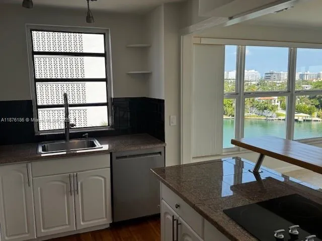 a couple of potted plants in front of door