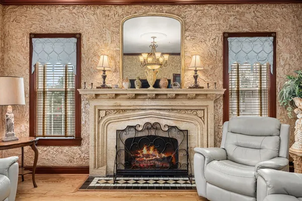 a living room with furniture and a fireplace