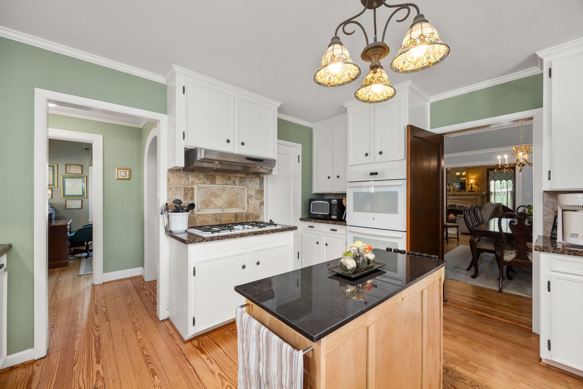 801 West Main Street Brenham, TX 77833 - Photo 18 of 50 You also have a dedicated cooking area with a five burner gas cooktop and vent hood.