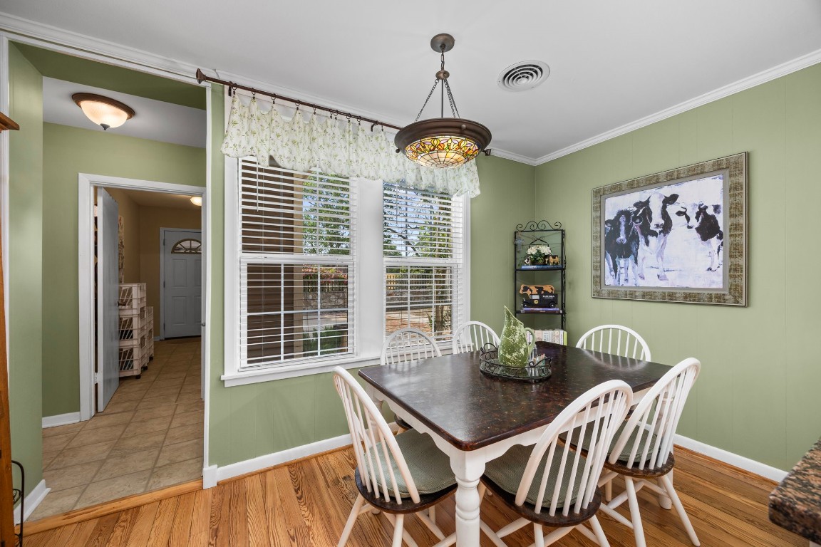 801 West Main Street Brenham, TX 77833 - Photo 19 of 50 The bright breakfast area is filled with natural light from large windows and offers a cozy space for casual dining.