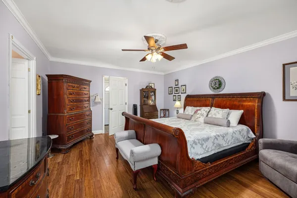a bedroom with a bed and a walk in closet
