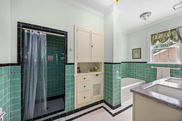 a kitchen with a refrigerator and a sink