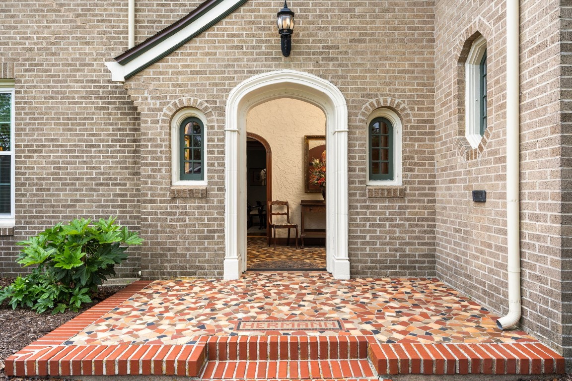 801 West Main Street Brenham, TX 77833 - Photo 3 of 50 A gracious arched entry welcomes you inside, framed by classic brickwork and charming architectural details. The terrazzo front porch creates a memorable first impression and showcases the timeless craftsmanship that has been carefully preserved throughout this historic home.