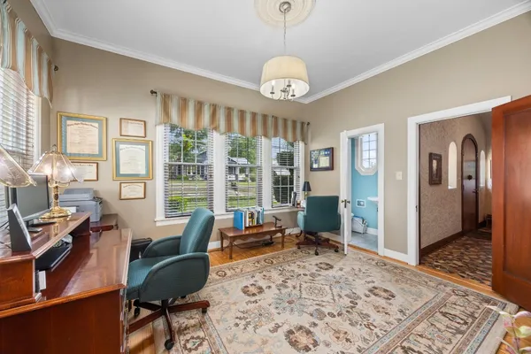 a view of a dining room with furniture window and wooden floor
