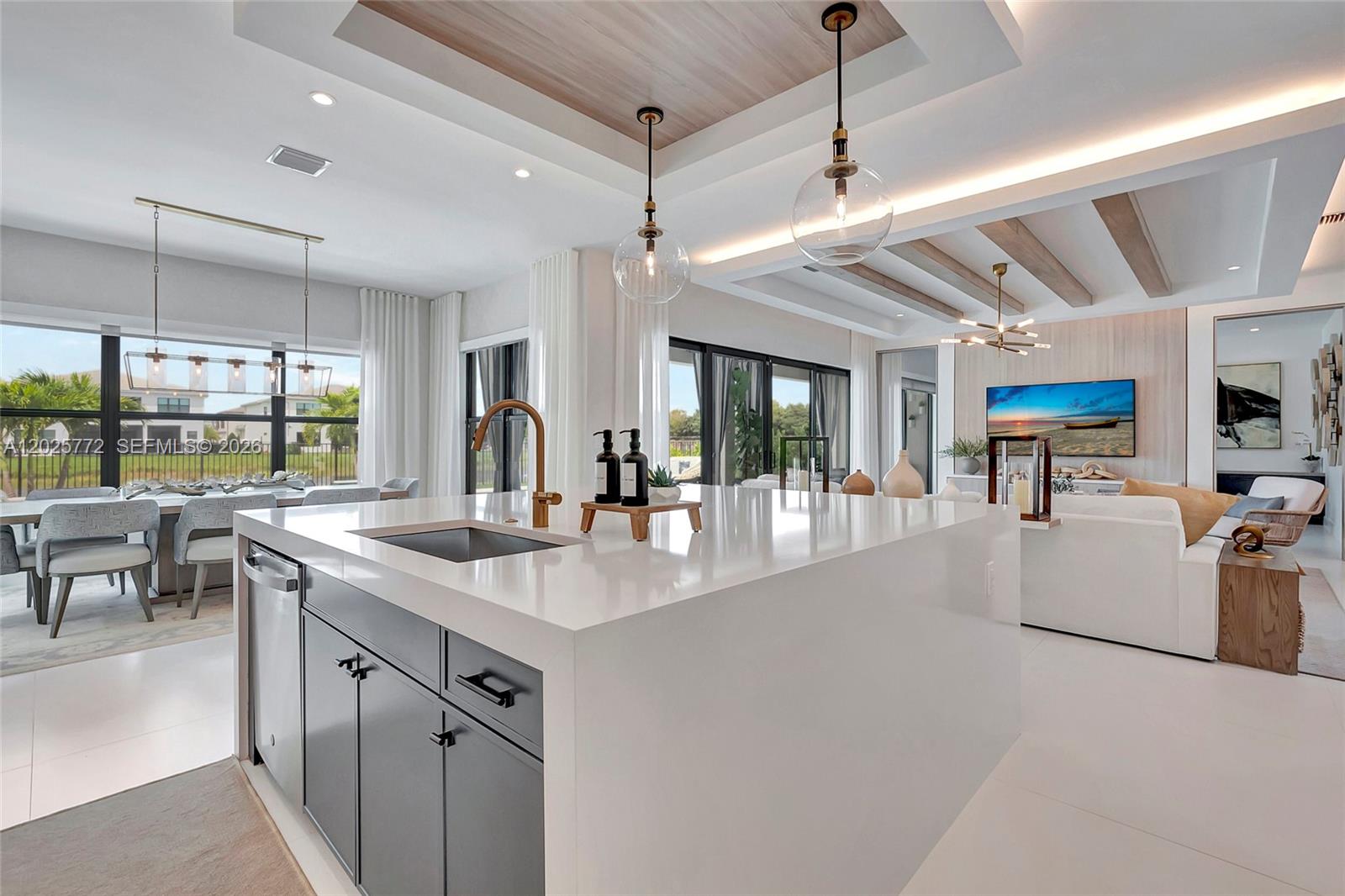 17023 Wandering Wave Avenue Boca Raton, FL 33496 - Photo 21 of 84 a kitchen with stainless steel appliances granite countertop a sink and a table
