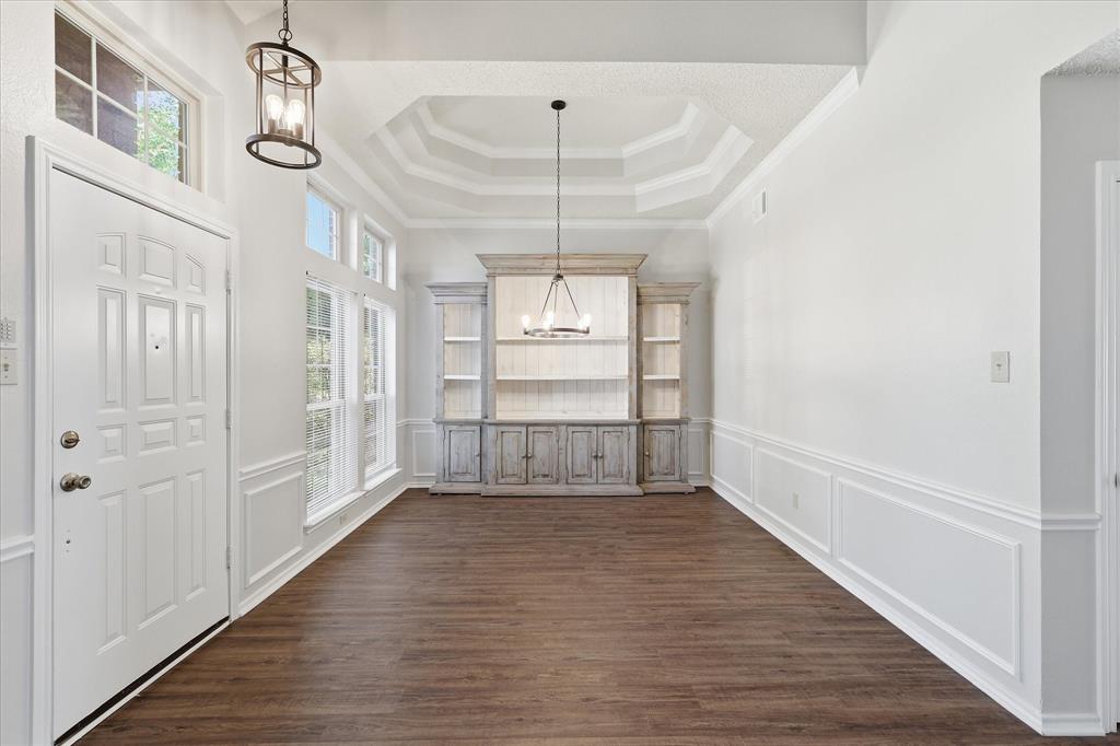 318 Lodge Road Coppell, TX 75019 - Photo 3 of 35 A dramatic tray ceiling, elegant millwork and abundant natural light create a memorable setting for everything from holiday dinners to intimate gatherings.