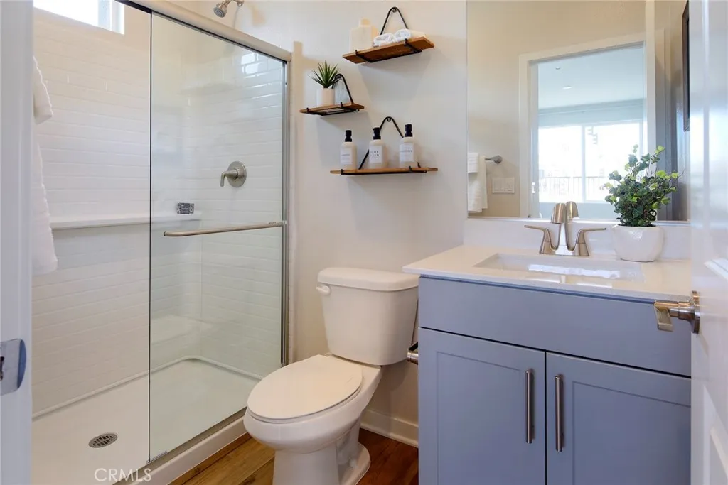 9520 Hannah Way Riverside, CA 92505 - Photo 16 of 22 a bathroom with a sink toilet and shower