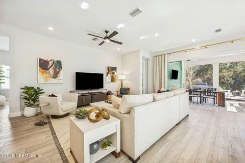 a living room with furniture and a rug