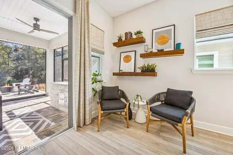 a living room with furniture and a potted plant