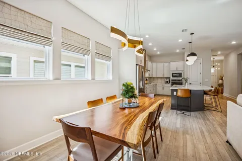 a spacious bedroom with a bed a couch and dresser