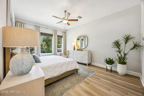 an aerial view of residential houses with outdoor space and ocean view