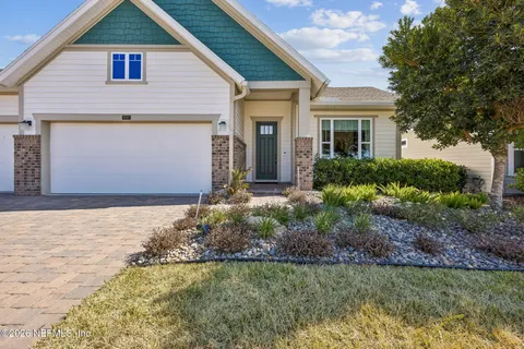 a view of a backyard of the house