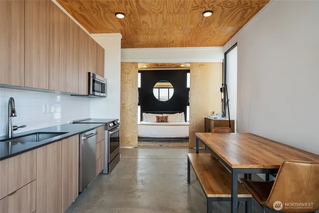 a kitchen with a sink and cabinets