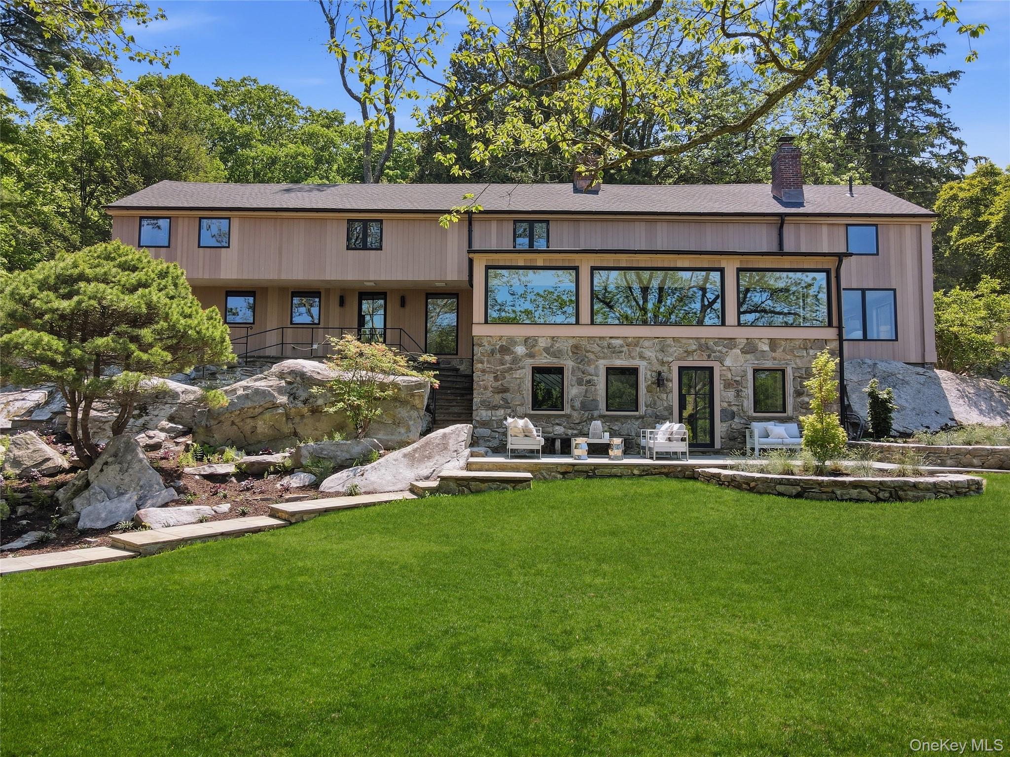 39 Old Snake Hill Road Pound Ridge, NY 10576 - Photo 37 of 37 a front view of house with yard and outdoor seating