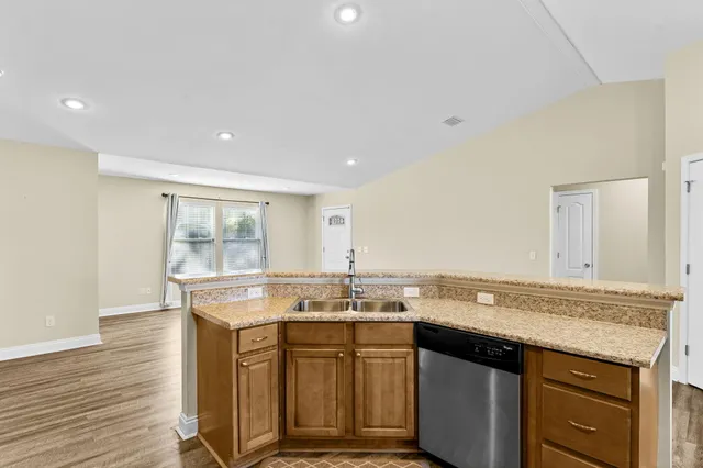 a sink with granite countertop a sink and cabinets