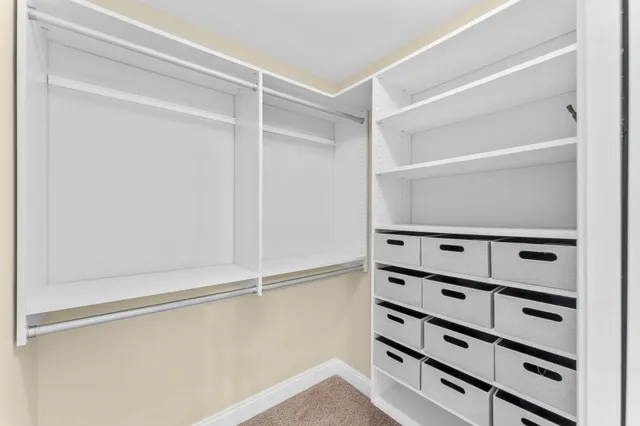 a view of an empty walk in closet