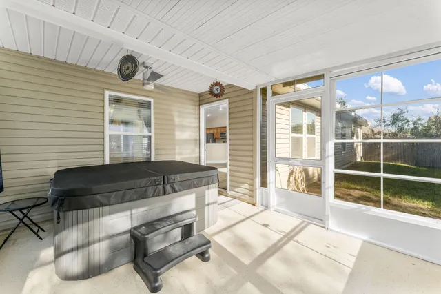 a view of a patio with a table and chairs