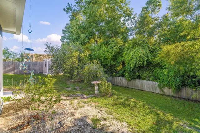 a backyard of a house with lots of green space