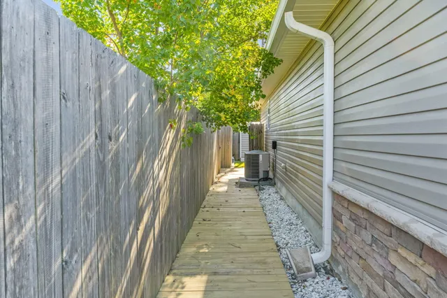 a view of a pathway with a backyard