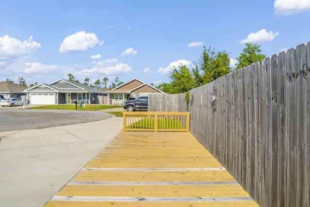 a view of multiple houses with a swimming pool