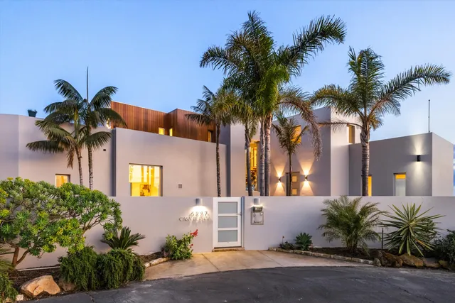 a kitchen with stainless steel appliances a sink and cabinets