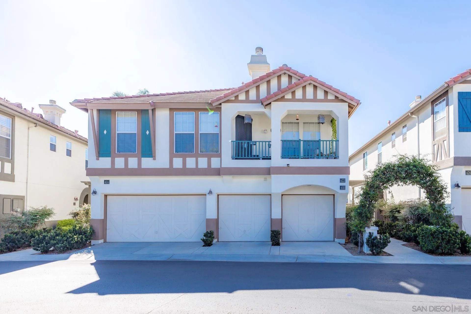 418 Carmel Creeper Place Encinitas, CA 92024 - Photo 1 of 31 a front view of a house with a yard and garage
