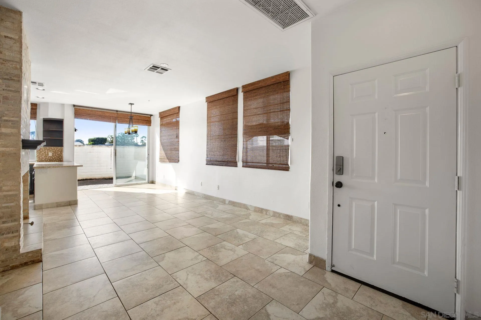 418 Carmel Creeper Place Encinitas, CA 92024 - Photo 13 of 31 a view of a kitchen with furniture and a window