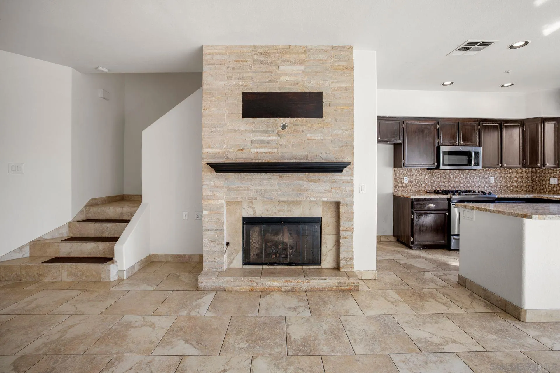 418 Carmel Creeper Place Encinitas, CA 92024 - Photo 14 of 31 a living room with furniture a fireplace and a flat screen tv