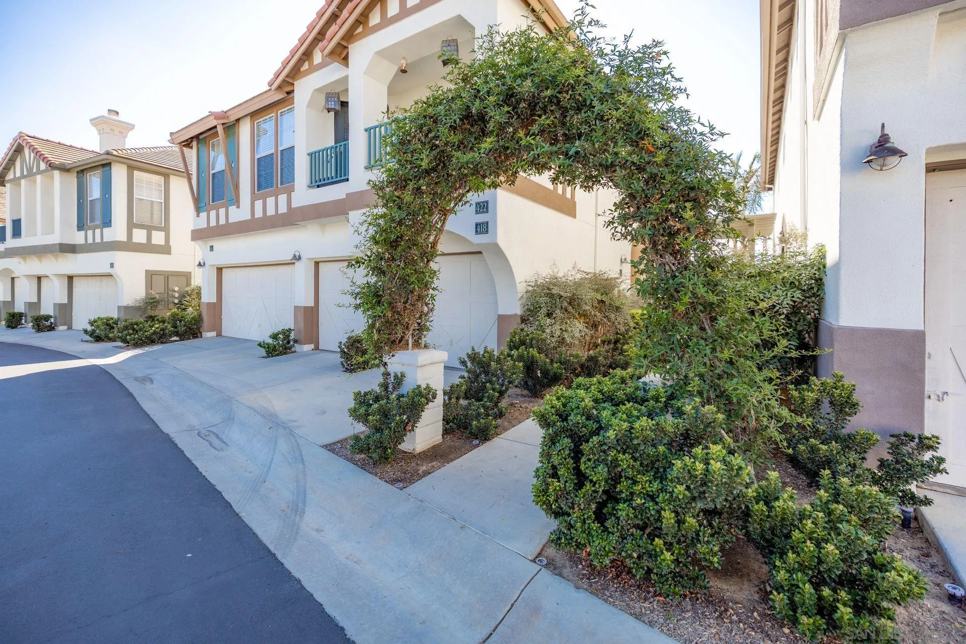 418 Carmel Creeper Place Encinitas, CA 92024 - Photo 2 of 31 a view of a house with a yard and garden
