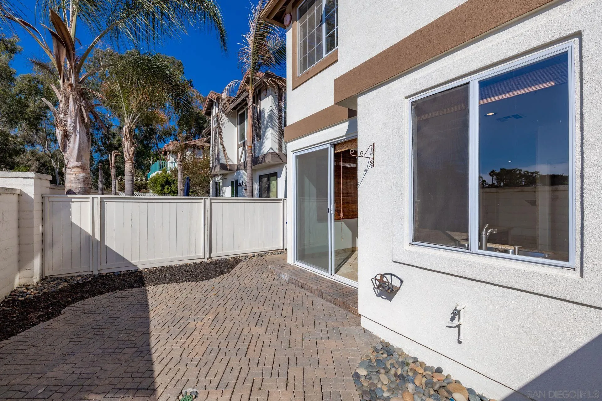 418 Carmel Creeper Place Encinitas, CA 92024 - Photo 8 of 31 a view of a house with a door and a window