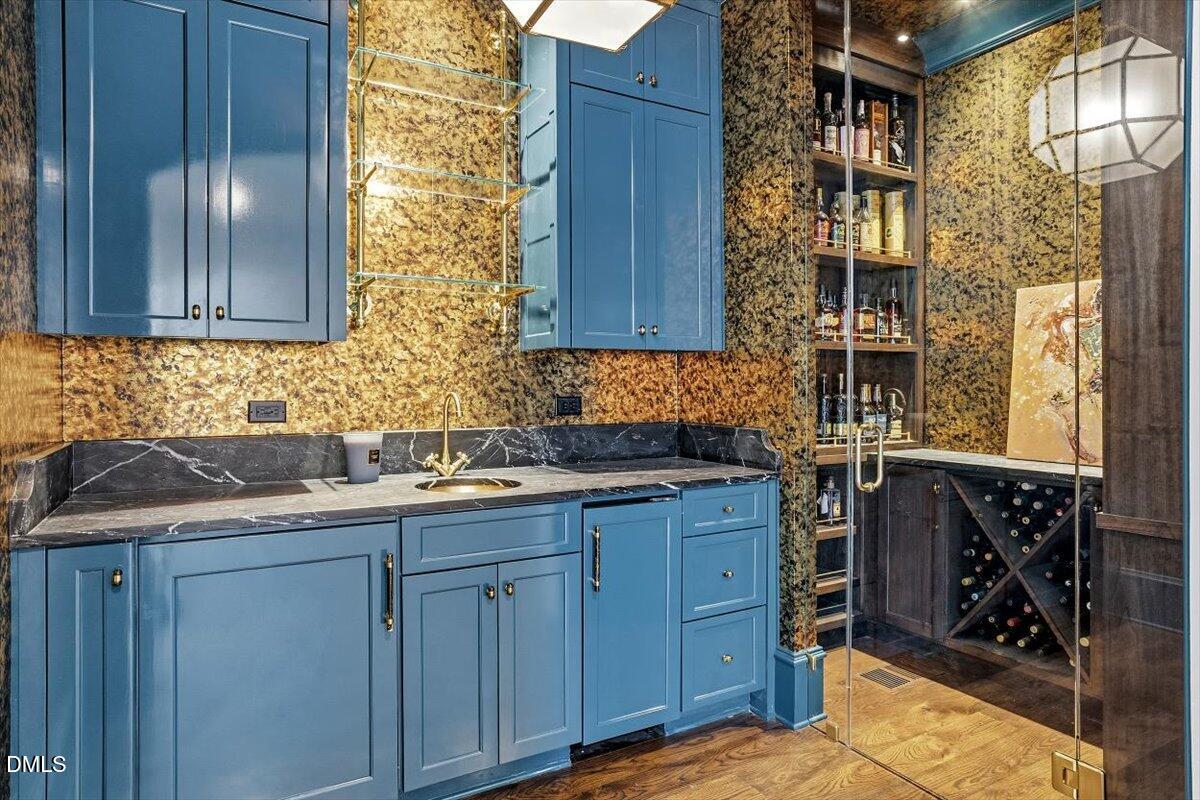 2123 St Marys Street Raleigh, NC 27608 - Photo 24 of 77 a kitchen with granite countertop a sink and cabinets