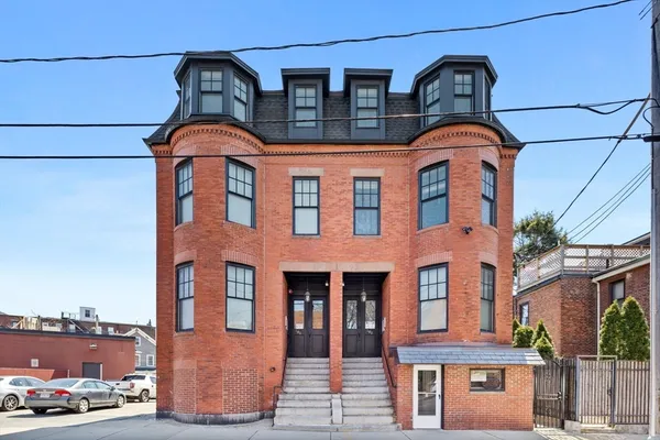 a multi story building with multiple windows