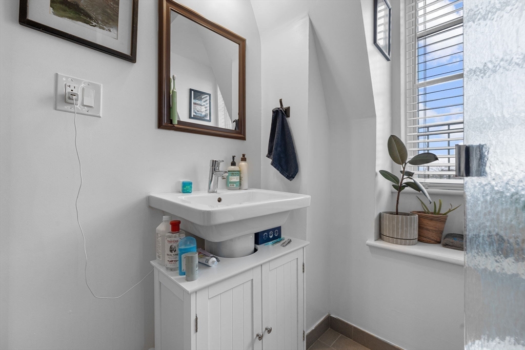 105 Broadway, Unit 3 Chelsea, MA 02150 - Photo 11 of 14 a bathroom with a sink and a mirror