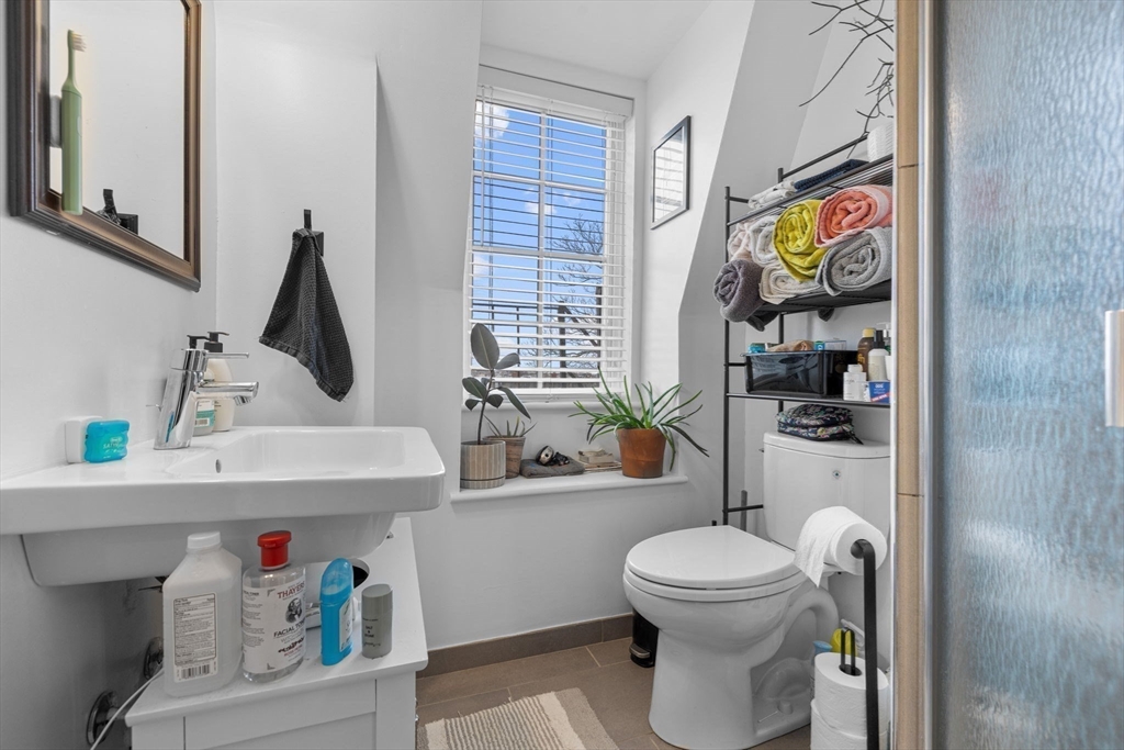105 Broadway, Unit 3 Chelsea, MA 02150 - Photo 12 of 14 a bathroom with a sink toilet and window