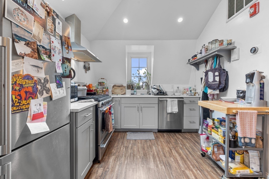 105 Broadway, Unit 3 Chelsea, MA 02150 - Photo 3 of 14 a kitchen with a white wooden cabinets and sink