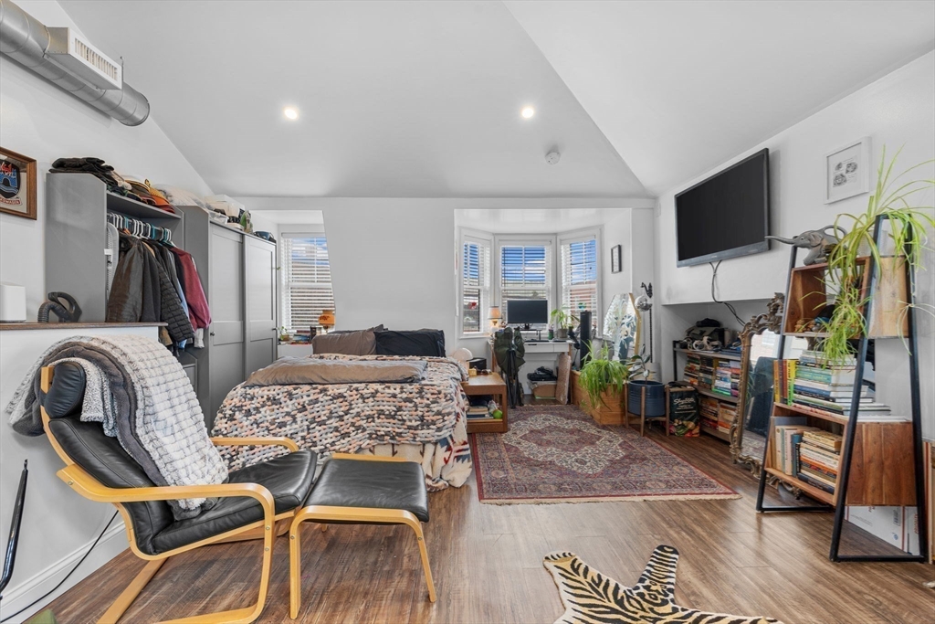 105 Broadway, Unit 3 Chelsea, MA 02150 - Photo 7 of 14 a view of a livingroom with furniture and a flat screen tv