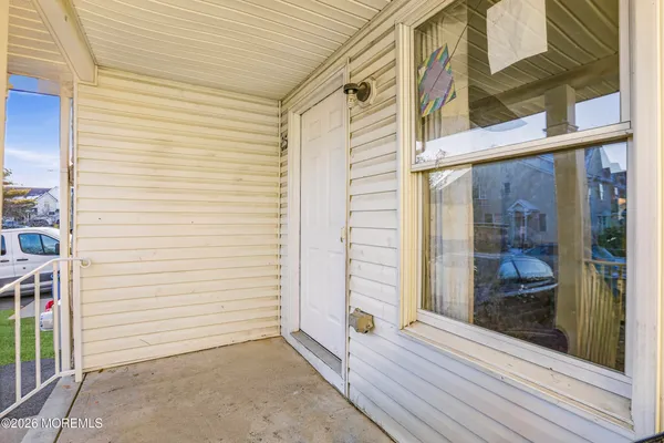 a view of a door with a door and wooden floor