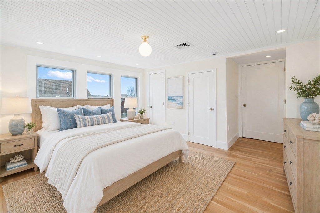 10 Fremont Street Gloucester, MA 01930 - Photo 16 of 37 a spacious bedroom with a bed and a couch