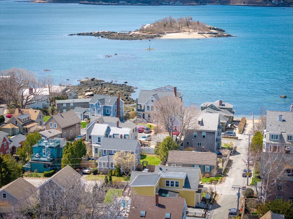10 Fremont Street Gloucester, MA 01930 - Photo 35 of 37 an aerial view of a city with lots of residential buildings ocean and mountain view in back